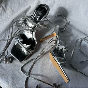 Silver butterfly appliqué strappy heel sandals with a touch of glamour